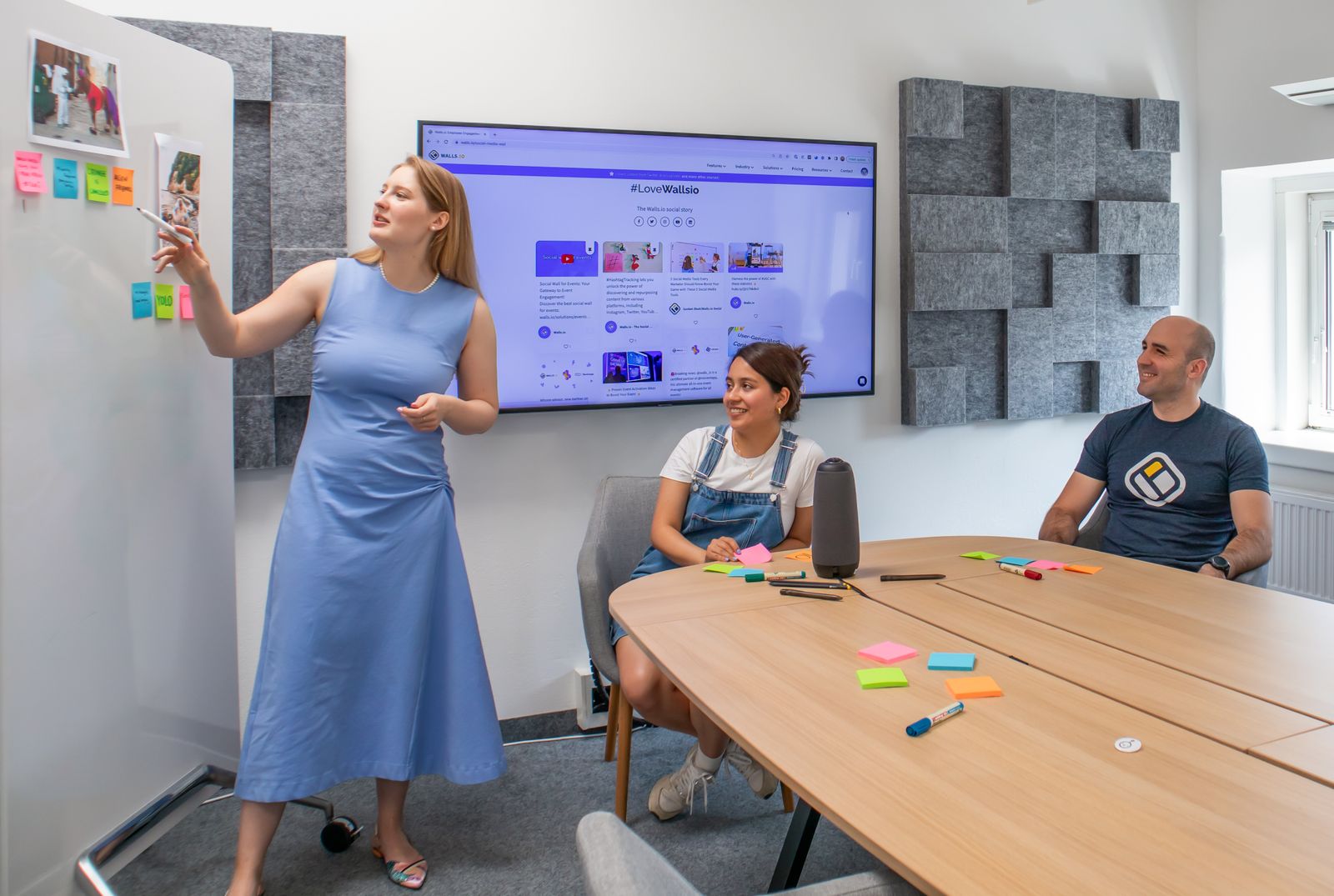 Colleagues reviewing figures together at a conference table