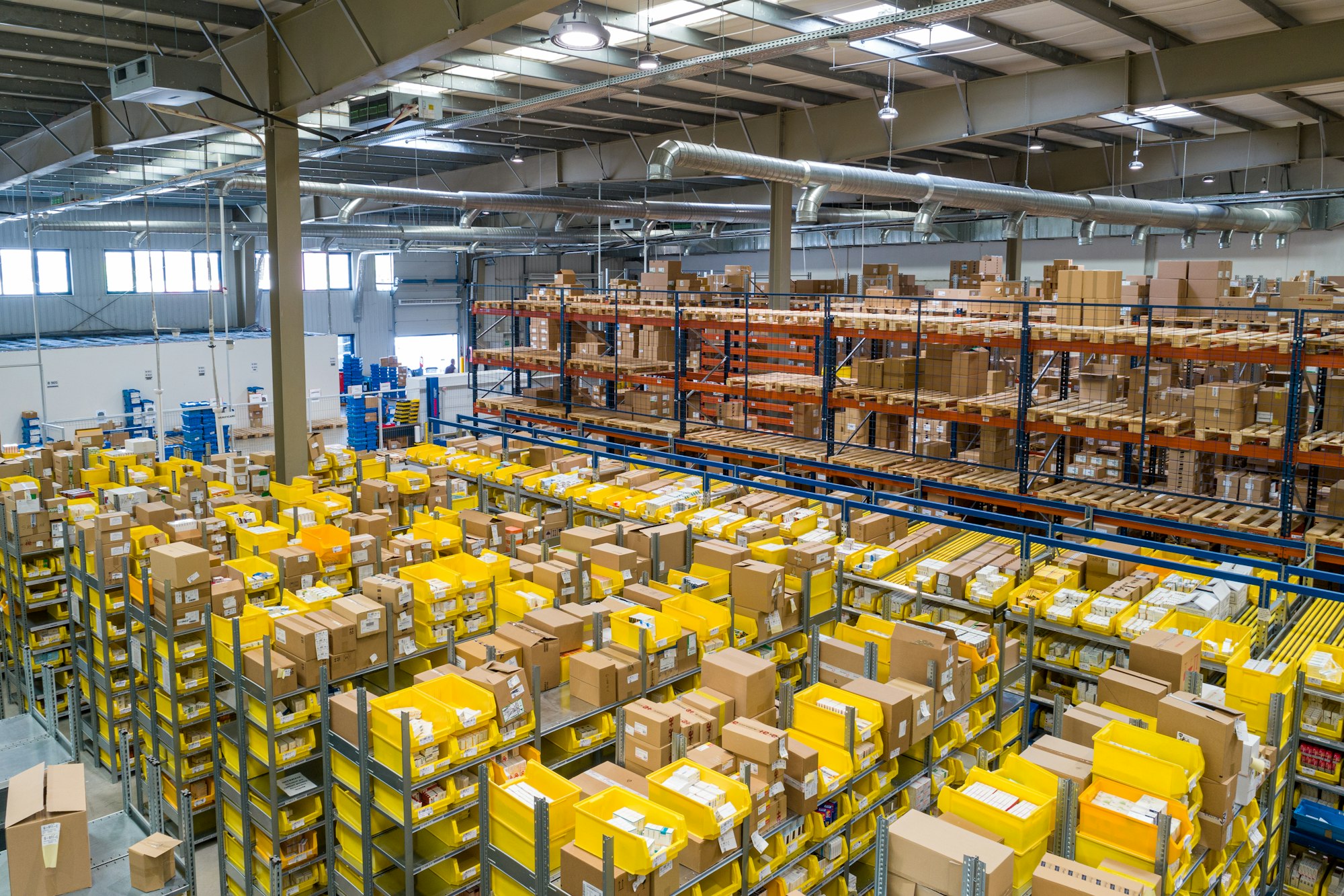 Distribution centre aisle with bins and cartons