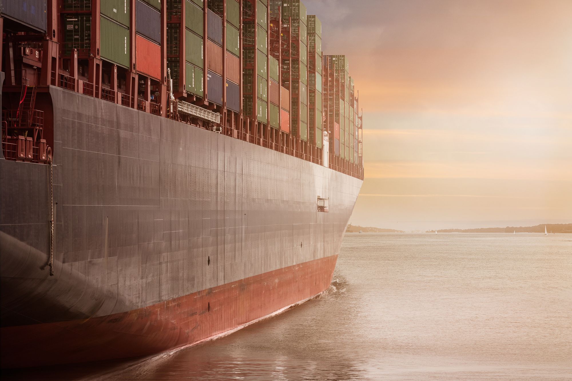 Container ship at sea, unmarked hull