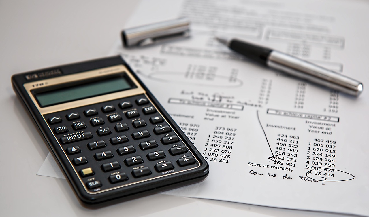 Calculator and billed amounts on a printed table