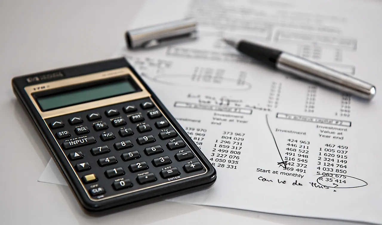 Calculator and billed amounts on a printed table