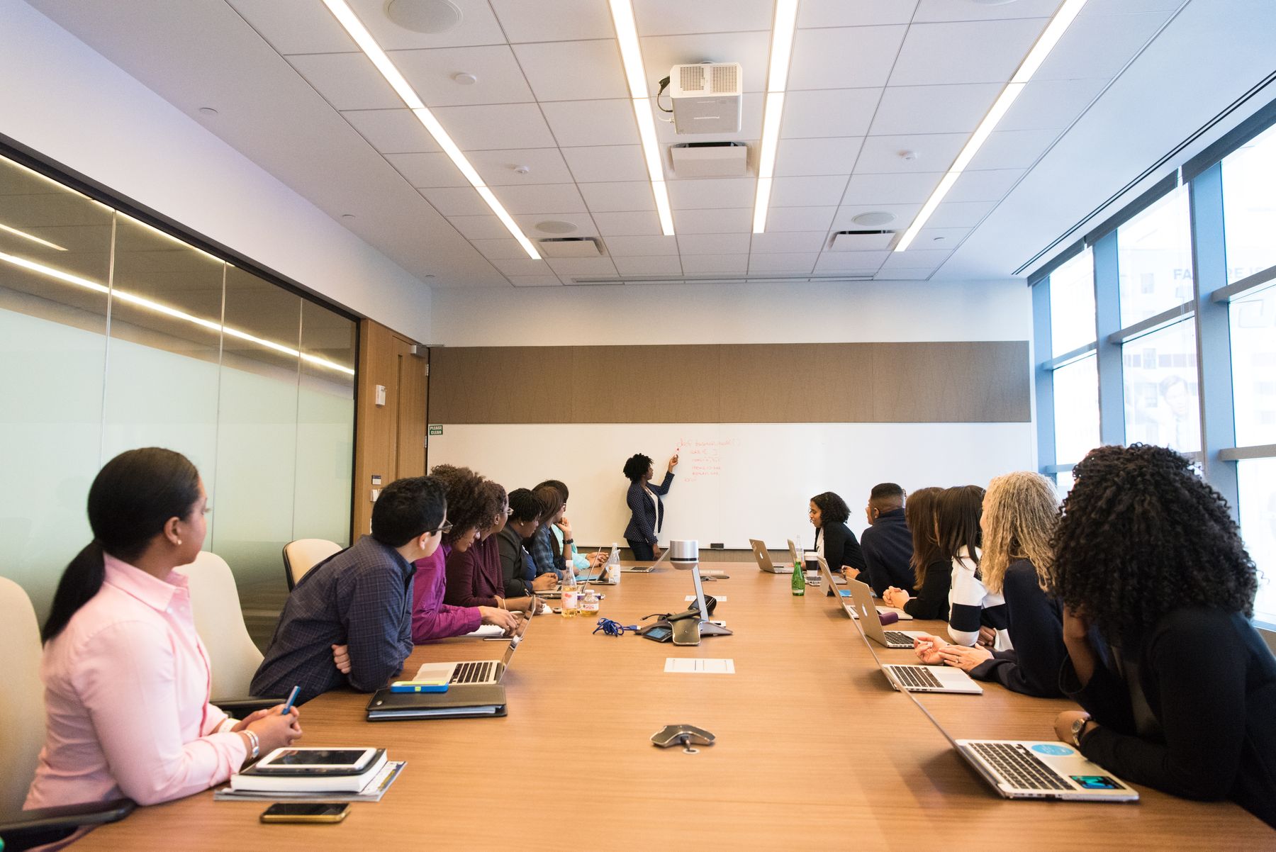 Team around a conference table in a bright meeting room