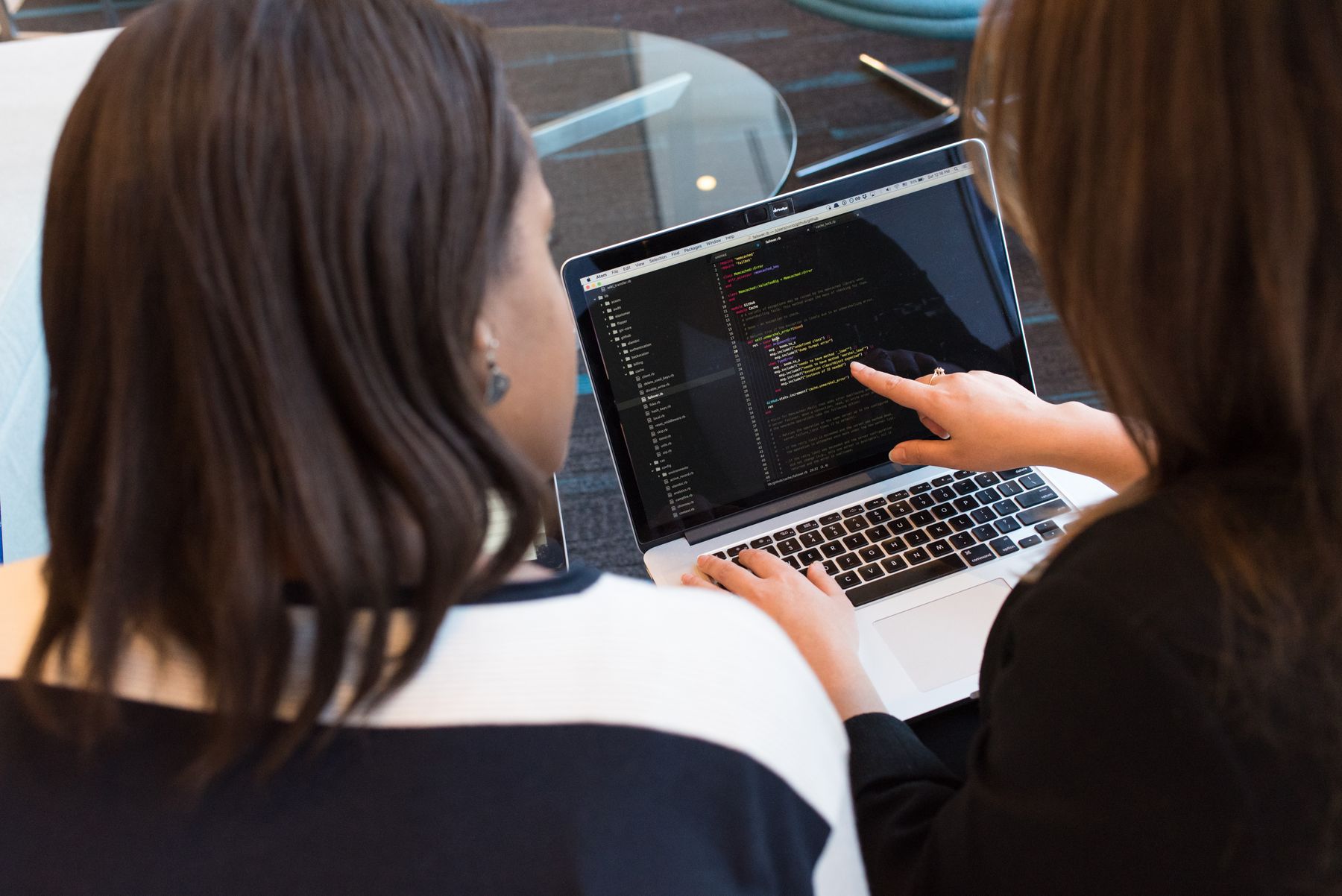 Two operators reviewing a laptop in an office